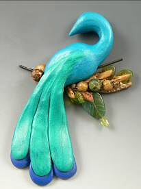 Clay peacock on a clay branch